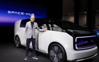 Toshihiro Mibe, director, president and representative executive officer of Honda Motor Co., poses next to the newly unveiled concept car, the Honda Zero Series "Space-Hub" electric vehicle during a Honda news conference during the CES tech show Tuesday, Jan. 9, 2024, in Las Vegas. 
(Ryan Sun / AP Photo)