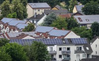 Solar panels are mounted on the roofs of apartment buildings in Bottrop, Germany, June 26, 2023. The world's renewable energy grew at its fastest rate in the past 25 years in 2023, the International Energy Agency reported Thursday, Jan. 11, 2024. 
(Martin Meissner / AP Photo)