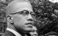 In this 1963 photo, Malcolm X attends a rally at Lennox Avenue and 115th Street in the Harlem neighborhood of New York. The Nebraska Legislature on Thursday, March 28, 2024 passed a bill to recognize the civil rights icon every May 19, the day Malcolm X was born Malcolm Little in Omaha, Nebraska, in 1925. The amendment recognizes May 19 as El-Hajj Malik El-Shabazz, Malcolm X Day, to allow Nebraska schools to hold exercises to recognize the civil rights leader. 
(Robert Haggins / AP Photo)