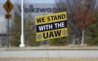 A "We stand with the UAW" sign appears outside of the Volkswagen plant in Chattanooga, Tenn., on Dec. 18, 2023. Workers at the Tennessee factory are scheduled to finish voting Friday, April 19, 2024, on whether they want to be represented by the United Auto Workers union. 
(Olivia Ross / Chattanooga Times Free Press via AP)