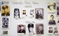 Photos of service members are seen on a wall in a Defense POW/MIA Accounting Agency lab at Offutt Air Force Base, Monday, May 20, 2024, in Bellevue, Neb. 
(Charlie Neibergall / AP Photo)