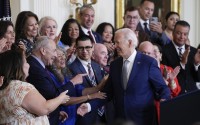 President Joe Biden turns to the others on the dais after speaking during an event marking the 12th anniversary of the Deferred Action for Childhood Arrivals program, in the East Room of the White House in Washington, Tuesday, June 18, 2024. 
(Susan Walsh / AP Photo)