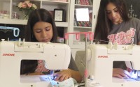 Giuliana Demma (left) and her sister Audrina sew pediatric hospital gowns in the basement of her Freehold, N.J., home on June 19, 2024. The sisters have sewn and donated 1,800 hospital gowns to sick children in 36 states plus Africa. Giuliana was inspired by seeing her baby cousin wearing an ugly, ill-fitting gown while hospitalized with brain cancer in 2017. 
(Wayne Parry / AP Photo)