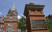 A sign stands in front of part of the Johns Hopkins Hospital complex, July 8, 2014, in Baltimore. Most medical students at Johns Hopkins University will no longer pay tuition thanks to a $1 billion gift from Bloomberg Philanthropies. Starting in the fall, the gift announced Monday, July 8, 2024 will cover full tuition for medical students from families earning less than $300,000.
 (Patrick Semansky / AP Photo, file)
