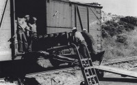 This image provided by Naval History and Heritage Command, shows African American Sailors of a naval ordnance battalion unloading aerial bombs from a railcar, circa 1943/44, in Port Chicago, Calif. The U.S. Navy has exonerated 256 Black sailors who were found to be unjustly punished in 1944 following a horrific port explosion that killed hundreds of service members and exposed racist double standards among the then-segregated ranks. 
(Naval History and Heritage Command / National Park Service via AP)