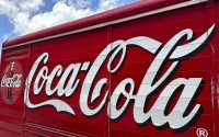 The Coca-Cola logo adorns the side of a delivery truck May 15, 2024, in southeast Denver. 
(David Zalubowski / AP Photo)