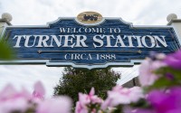 A community welcome sign on the corner Main Street and Dundalk Avenue is pictured, Friday, Aug. 16, 2024, in Turner Station, Md. 
(Stephanie Scarbrough / AP Photo)