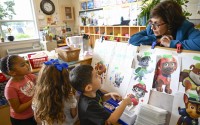 Preschool Executive Director Maria Isabel Ballivian (right) listens to her students on what characters of the TV show PAW Patrol they will vote for as their favorite character at the ACCA Child Development Center, Thursday, Sept. 19, 2024, in Annandale, Va. The students are getting foundational lessons on how to live in a democracy by allowing them to regularly vote on different things through out the day.
(AP Photo / John McDonnell)