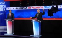 Democratic vice presidential nominee Minnesota Gov. Tim Walz (right) speaks during a vice presidential debate hosted by CBS News, with Republican vice presidential nominee Sen. JD Vance, R-Ohio (left), Tuesday, Oct. 1, 2024, in New York. 
(Matt Rourke / AP Photo)