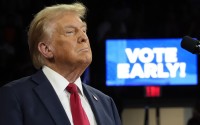 With "Vote Early" displayed on a screen behind, Republican presidential nominee former President Donald Trump speaks at a campaign rally at the Santander Arena, Wednesday, Oct. 9, 2024, in Reading, Pa. 
(Alex Brandon / AP Photo)