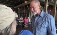Independent Dan Osborn, a challenger to two-term Republican Sen. Deb Fischer, chats with patrons of a brewery in Beatrice, Neb., July 30, 2024. 
(Margery Beck / AP Photo)