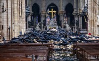 A hole is seen in the dome inside Notre Dame cathedral after the fire in Paris, Tuesday, April 16, 2019. The Cathedral is set to reopen to the public on Sunday, December 8, 2024.
(Christophe Petit Tesson / AP Photo)
