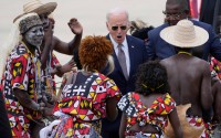 President Joe Biden watches a traditional dance after arriving at Catumbela airport in Angola on Wednesday, Dec. 4, 2024. 
(Ben Curtis / AP Photo)