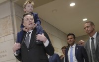 Elon Musk carrying his son X Æ A-Xii, and Vivek Ramaswamy arrive for a roundtable meeting to discuss President-elect Donald Trump's planned Department of Government Efficiency, Thursday, Dec. 5, 2024, on Capitol Hill in Washington. 
(Mariam Zuhaib / AP Photo)