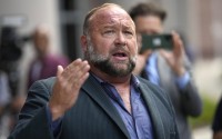 Alex Jones speaks to the media after arriving at the federal courthouse for a hearing in front of a bankruptcy judge, June 14, 2024, in Houston. 
(David J. Phillip / AP Photo)