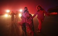 Residents and staff at Pasadena Park Healthcare & Wellness Center evacuate as the Eaton Fire approaches on Jan. 7, 2025, in Altadena, Calif. 
(Ethan Swope / AP Photo)