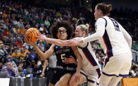 Notre Dame guard Olivia Miles (5) is fouled by TCU guard Hailey Van Lith (10) as she drives to the basket during the first half in the Sweet 16 of the NCAA college basketball tournament, Saturday, March 29, 2025, in Birmingham, Ala. 
(Butch Dill / AP Photo)