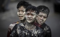 Thai people with faces stained with paint take part in the Songkran water festival to celebrate the Thai New Year in Prachinburi Province, Thailand, Sunday, April 13, 2025. 
(Wason Wanichakorn / AP Photo)