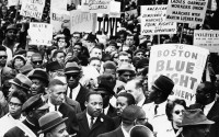 Dr. Martin Luther King Jr., is completely surrounded as he leads a civil rights march in Boston, April 23, 1965, en route to historic Boston Common where he will address a crowd.
 (AP Photo)