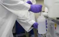 Logan Feeney pours a water sample with forever chemicals, known as PFAS, into a container for research, April 10, 2024, at a U.S. Environmental Protection Agency lab in Cincinnati.
 (Joshua A. Bickel / AP Photo)