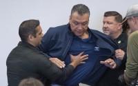 U.S. Sen. Alex Padilla, D-Calif., is pushed out of the room as Homeland Security Secretary Kristi Noem holds a news conference regarding the recent protests in Los Angeles, Thursday, June 12, 2025. 
(David Crane / The Orange County Register via AP)