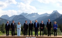 European Council President Antonio Costa (from left) Japan's Prime Minister Shigeru Ishiba, Italian Prime Minister Giorgia Meloni, French President Emmanuel Macron, Canada's Prime Minister Mark Carney, U.S. President Donald Trump, Britain's Prime Minister Keir Starmer, German Chancellor Friedrich Merz and European Commission President Ursula von der Leyen pose for a family photo during the G7 Summit, in Kananaskis, Alberta, Monday, June 16, 2025. 
(Suzanne Plunkett / Pool Photo via AP)