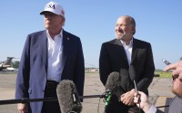 President Donald Trump (left) listens as Commerce Secretary Howard Lutnick speaks with reporters before boarding Air Force One at Morristown Municipal Airport in Morristown, N.J., Sunday, July 6, 2025, en route to Washington. 
(Jacquelyn Martin / AP Photo)