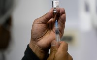 A healthcare worker prepares a shot of the Pfizer COVID-19 vaccine in La Paz, Bolivia, Jan. 7, 2025. 
(Juan Karita / AP Photo)