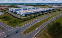 Cars drive past data centers that house computer servers and hardware required to support modern internet use, such as artificial intelligence, in Ashburn, Virginia, July 16, 2023. 
(Ted Shaffrey / AP Photo)
