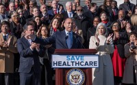 House Minority Leader Hakeem Jeffries, D-N.Y., joined by the Democratic Caucus, speaks to reporters as they call for a vote on an extension of Affordable Care Act subsidies, at the Capitol in Washington, Thursday, Dec. 18, 2025. 
(J. Scott Applewhite / AP Photo)
