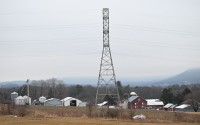 A 235-kilovolt power line towers over farm buildings near where the local power utility plans to build a 500-kilovolt power line on towers as tall as 240 feet, March 4, 2026, in Sugarloaf, Pa. 
(Marc Levy / AP Photo)