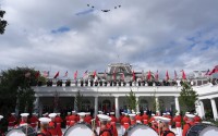 A military flyover is pictured as President Donald Trump, first lady Melania Trump, China's President Xi Jinping and his wife Peng Liyuan watch a military review in the Rose Garden of the White House, Thursday, Sept. 24, 2026, in Washington. 
(Alex Brandon / AP Photo)
