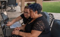 On Aug. 3, 2021, Intel announced a broad expansion of its AI for Workforce Program at 18 community colleges across 11 U.S. states. Among the students enrolled in an early pilot program at Maricopa Community College in Arizona are Penny (right) and Stacy Good, a mother and daughter who live in a suburb of Phoenix. 
 (Evan Sprague / Intel Corporation / AP)