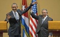 March 21, 2016, former Cuban President Raul Castro (right) lifts up the arm of President Barack Obama at the conclusion of their joint news conference at the Palace of the Revolution in Havana, Cuba. Brushing off decades of distrust, Obama and Castro shook hands, a remarkable moment for two countries working to put the bitterness of their Cold War-era enmity behind them. 
(Ramon Espinosa / AP Photo)