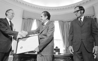 U.S. President Richard Nixon presents to Lewis F. Powell, Jr. a framed commission as an Associate Justice of the Supreme Court during a ceremony at the White House in Washington, D.C., Wednesday, Dec. 22, 1971. 
 (Henry Burroughs / AP Photo)