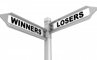 Road sign showing direction of winners and losers.
(Shutterstock)