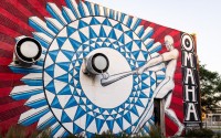 Justin Queal’s mural off on the northwest corner of 17th and Cuming streets celebrating Omaha’s baseball culture. The city has hosted the College World Series since 1950. 
(Joseph Saaid / Flatwater Free Press)