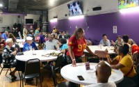 Family members catch up during the Dozens of Cousins party at the North Omaha Elks Lodge on Saturday, Aug. 8. The party was part of the 109th Bryant-Fisher family reunion. 
(Victoria White / Flatwater Free Press)