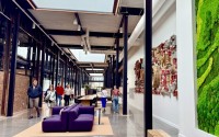 The Catalyst adaptive reuse project in midtown Omaha is to get an award at this year’s CRE Summit. Shown here is a corridor of the co-working hub, which used to be an alleyway on an old steel plant campus. The building is expected to be a magnet for innovative health care businesses. 
(Cindy Gonzalez / Nebraska Examiner)