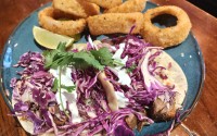 The Short Rib Taco and onion rings are pretty to look at, and edible otherwise. The sauce would have been better served on the side. 
(Austin Petak / The Daily Record)