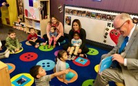 Brian Maher, Nebraska's education commissioner, reads a book to a group of mostly 3-year-olds as he and others launch a statewide project to boost reading skills of pre-kindergarteners on Oct. 30, 2023. 
(Cindy Gonzalez / Nebraska Examiner)