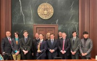 Creighton Prep students standing with their coaches and Justice Funke and Judge Bazis following the championship round of the state competition against Duchesne Academy. This year’s team secured a win at the Federal Courthouse in Omaha, Neb. on December 5-6, 2022. (Courtesy of Nebraska State Bar Foundation)