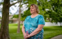 Jacque Palczynski, the mother of a son who struggles with a serious mental illness, poses for a photo June 6. Palczynski has tried several times to commit her son and force him to receive treatment for his schizoaffective disorder. But the safety net in Douglas County has not helped, she said, which has led her son to cycling in and out of hospitals and jail. 
(Abiola Kosoko / Flatwater Free Press)
