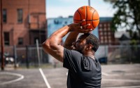 Josh Jones prepares to fire up a shot. He shot countless jumpers at these Bryant Center hoops while growing up a few blocks away. Only later did he learn that the Bryant Center was at the center of his neighborhood’s history. “Those courts, bro? Legendary,” Jones says. “Le-gen-da-ry!” (Abiola Kosoko / Flatwater Free Press) 