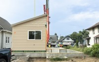 A for-sale house built by students at Metropolitan Community College’s Fort Omaha campus was transported in pieces Friday to its final destination in the Miller Park neighborhood of North Omaha. 
(Courtesy of Metropolitan Community College)