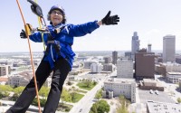 Sister Stephanie Matcha, 81, raised more than $3,000 as part of a fundraiser to support the Siena Francis House when she rappelled down the side of The Highline Apartments in downtown Omaha on May 3. 
(Anna Reed / Flatwater Free Press)
