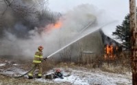 Several homes have been burned down and buried in Winslow after owners took a federal buyout to make their lots permanent green spaces. Only about 15 homes remain in a town that recently had 140 residents. 
(Paul Hammel / Nebraska Examiner)