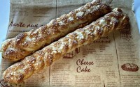 Braided croissant dough is topped with fresh Parmigiano-Reggiano cheese, making for a crisp-tender, savory treat. 
(Sarah Baker Hansen / Flatwater Free Press)