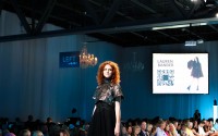 A model poses at the end of the runway wearing headliner Lauren Bander’s collection. (Josie Charron / The Daily Record)