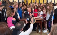 President Donald Trump signs an executive order restricting sports participation in K-12 schools and colleges to a student’s sex at birth and setting up penalties for institutions that do not comply. Nebraska Gov. Jim Pillen, not pictured, was among those in attendance for the ceremony on Feb. 5, 2025. 
(Courtesy of Office of Gov. Jim Pillen)